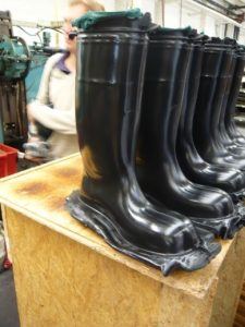 Rubber boots manufactured by compression molding